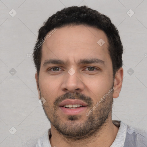 Neutral white young-adult male with short  black hair and brown eyes