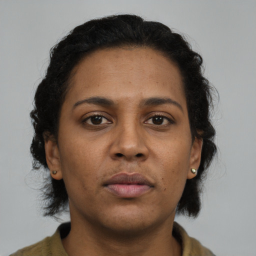 Neutral black young-adult female with short  brown hair and brown eyes