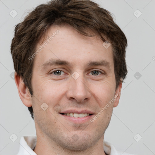 Joyful white adult male with short  brown hair and grey eyes