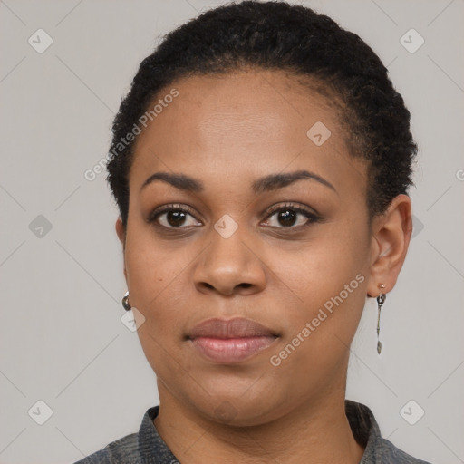 Joyful black young-adult female with short  black hair and brown eyes