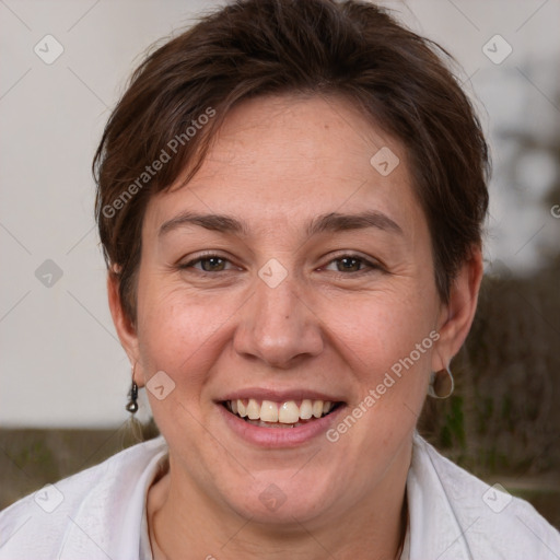 Joyful white adult female with short  brown hair and brown eyes