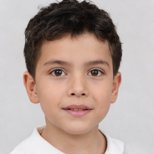 Joyful white child male with short  brown hair and brown eyes