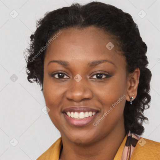 Joyful black young-adult female with short  brown hair and brown eyes