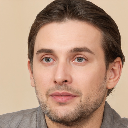 Joyful white young-adult male with short  brown hair and brown eyes