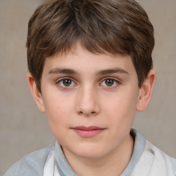 Joyful white child male with short  brown hair and brown eyes