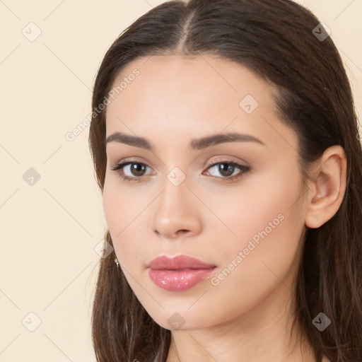 Neutral white young-adult female with long  brown hair and brown eyes