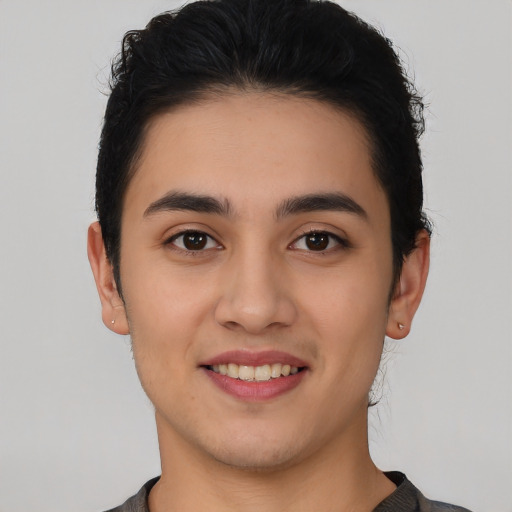 Joyful white young-adult female with short  black hair and brown eyes