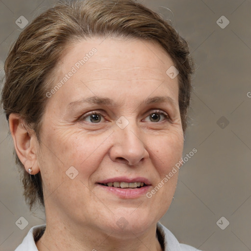 Joyful white adult female with medium  brown hair and brown eyes