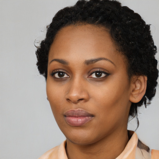 Neutral black young-adult female with medium  black hair and brown eyes