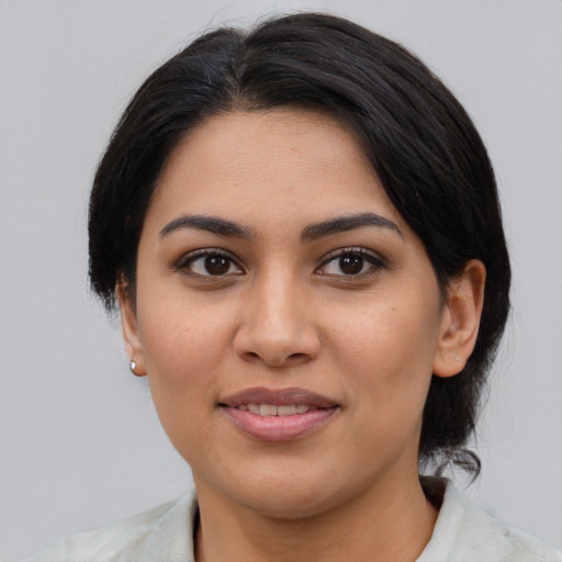 Joyful asian young-adult female with medium  brown hair and brown eyes