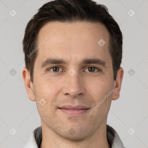 Joyful white young-adult male with short  brown hair and brown eyes