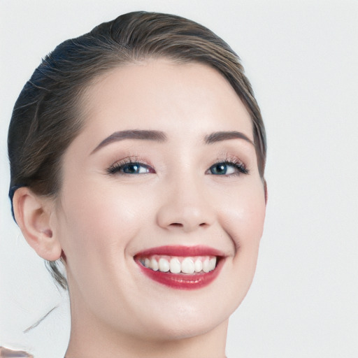 Joyful white young-adult female with medium  brown hair and blue eyes