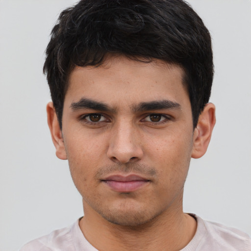 Neutral white young-adult male with short  black hair and brown eyes