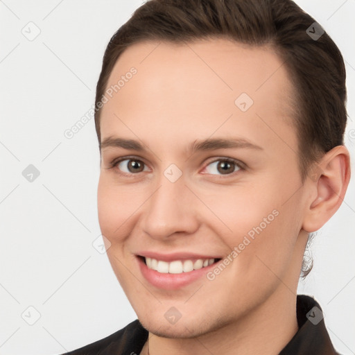 Joyful white young-adult female with short  brown hair and brown eyes