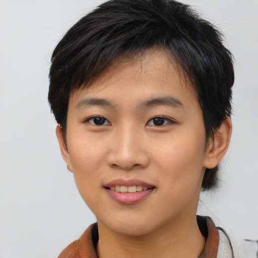 Joyful asian young-adult female with short  black hair and brown eyes