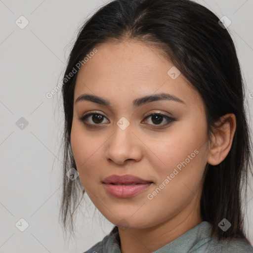 Joyful latino young-adult female with long  brown hair and brown eyes