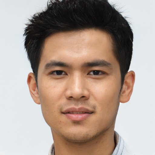 Joyful asian young-adult male with short  black hair and brown eyes