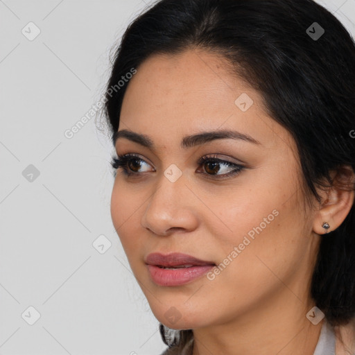 Joyful latino young-adult female with medium  black hair and brown eyes