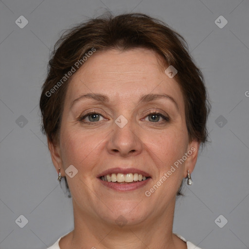 Joyful white adult female with medium  brown hair and blue eyes