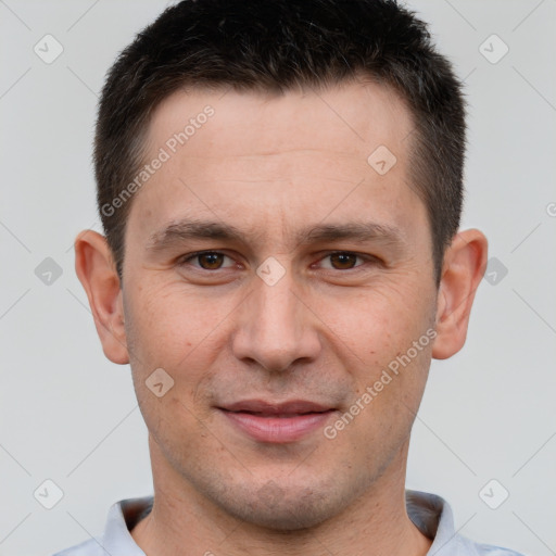 Joyful white adult male with short  brown hair and brown eyes