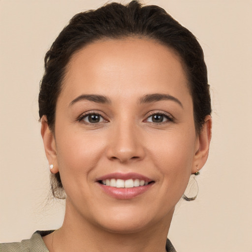 Joyful white young-adult female with medium  brown hair and brown eyes