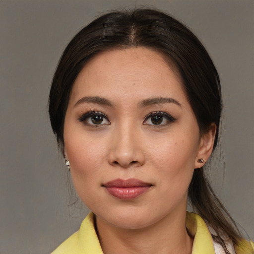 Joyful asian young-adult female with medium  brown hair and brown eyes