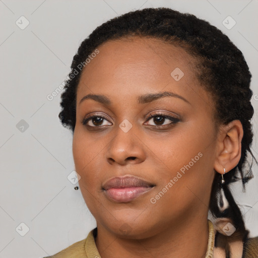 Joyful black young-adult female with short  black hair and brown eyes