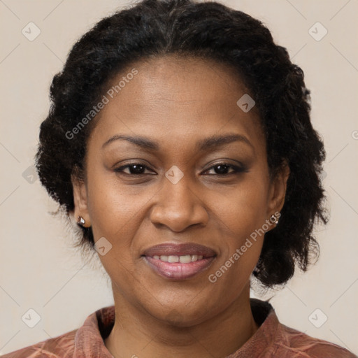 Joyful black adult female with short  brown hair and brown eyes