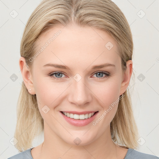 Joyful white young-adult female with medium  brown hair and blue eyes