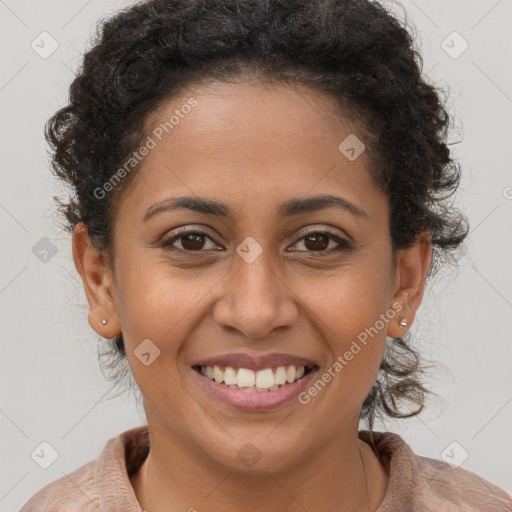 Joyful latino young-adult female with long  brown hair and brown eyes