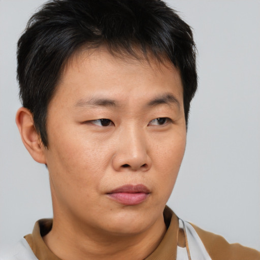 Neutral asian young-adult male with short  brown hair and brown eyes