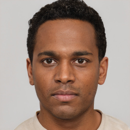 Neutral black young-adult male with short  brown hair and brown eyes