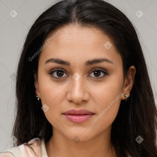 Joyful latino young-adult female with long  brown hair and brown eyes