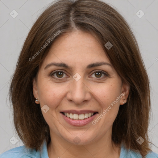 Joyful white adult female with medium  brown hair and brown eyes