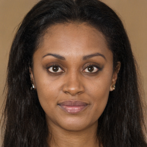Joyful latino young-adult female with long  brown hair and brown eyes