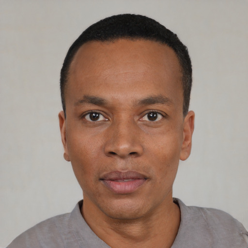 Neutral black young-adult male with short  black hair and brown eyes