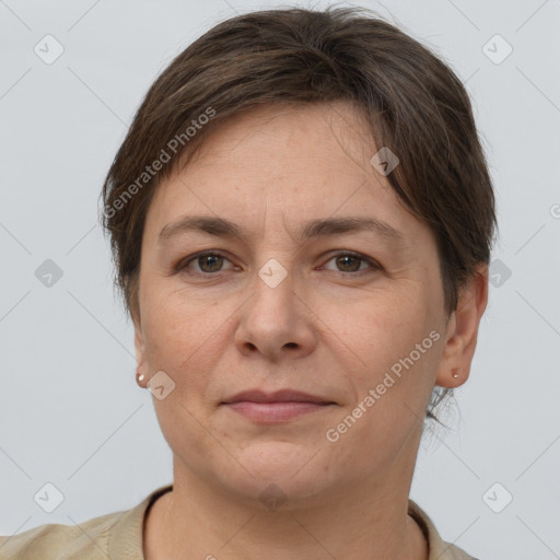 Joyful white adult female with short  brown hair and grey eyes