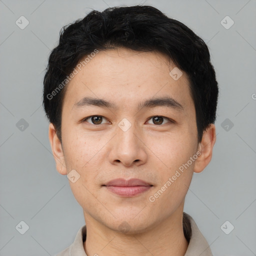 Joyful asian young-adult male with short  black hair and brown eyes