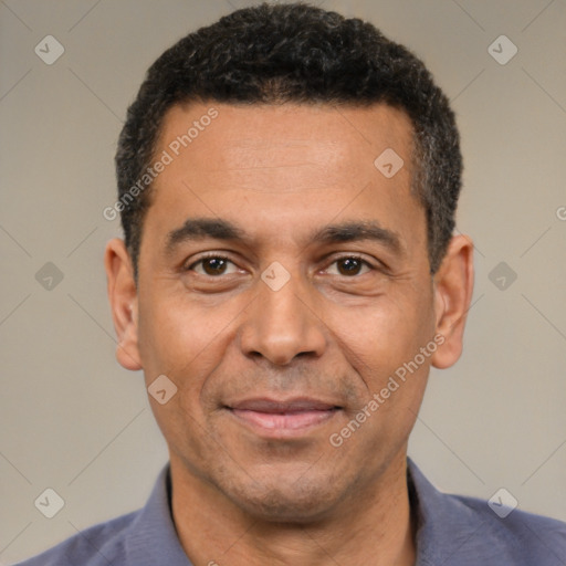 Joyful white adult male with short  black hair and brown eyes