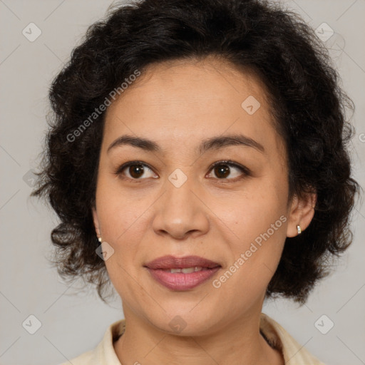 Joyful latino adult female with medium  brown hair and brown eyes