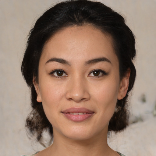 Joyful asian young-adult female with medium  brown hair and brown eyes