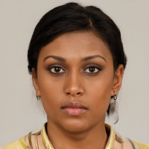 Neutral latino young-adult female with medium  brown hair and brown eyes