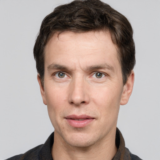 Neutral white adult male with short  brown hair and grey eyes