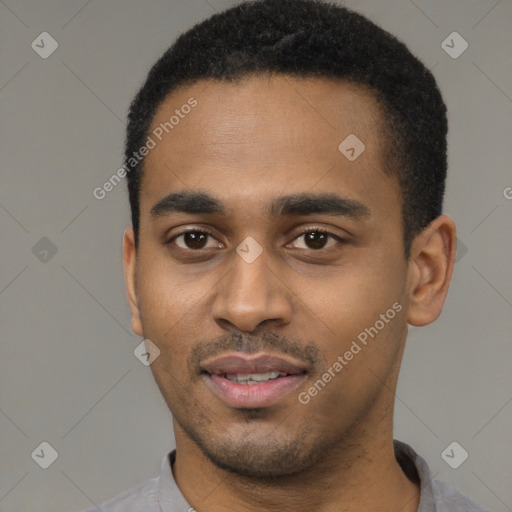 Joyful black young-adult male with short  black hair and brown eyes