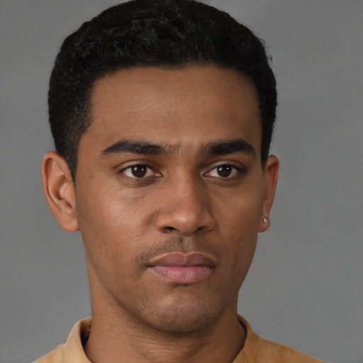 Neutral latino young-adult male with short  brown hair and brown eyes