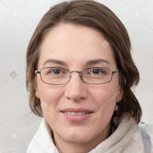 Joyful white adult female with medium  brown hair and blue eyes