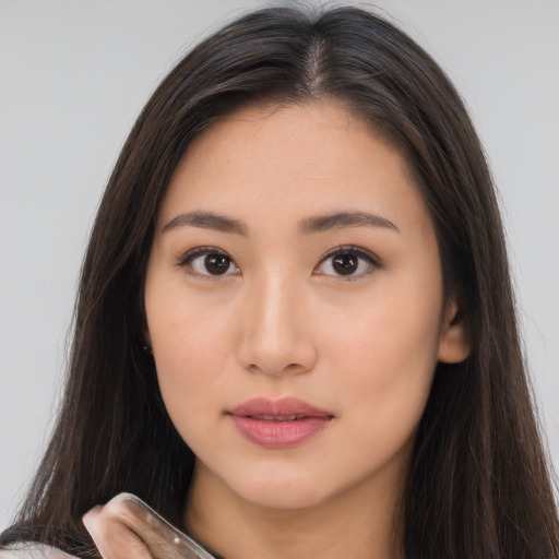 Neutral asian young-adult female with long  brown hair and brown eyes
