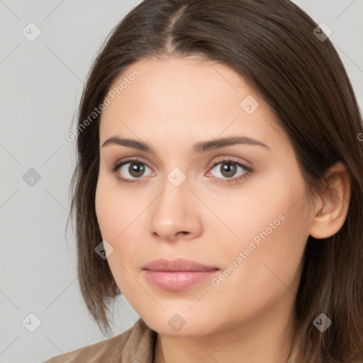 Neutral white young-adult female with long  brown hair and brown eyes