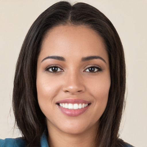 Joyful white young-adult female with long  brown hair and brown eyes