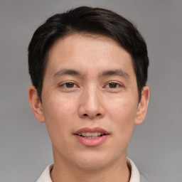 Joyful asian young-adult male with short  brown hair and brown eyes